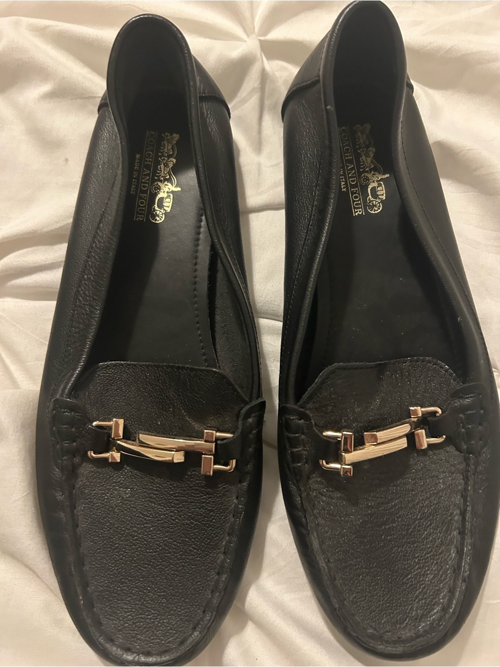 Coach and Four Black Leather Slip-On Loafers with Gold Logo